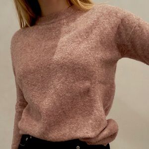 oversized pink Aritzia crewneck sweater